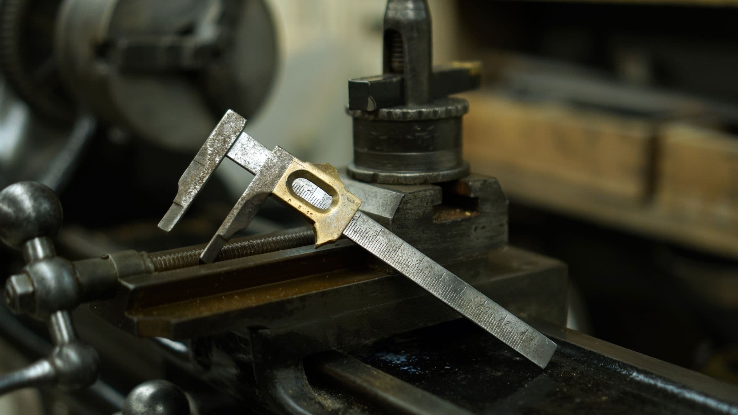 Precision caliper resting on industrial machinery